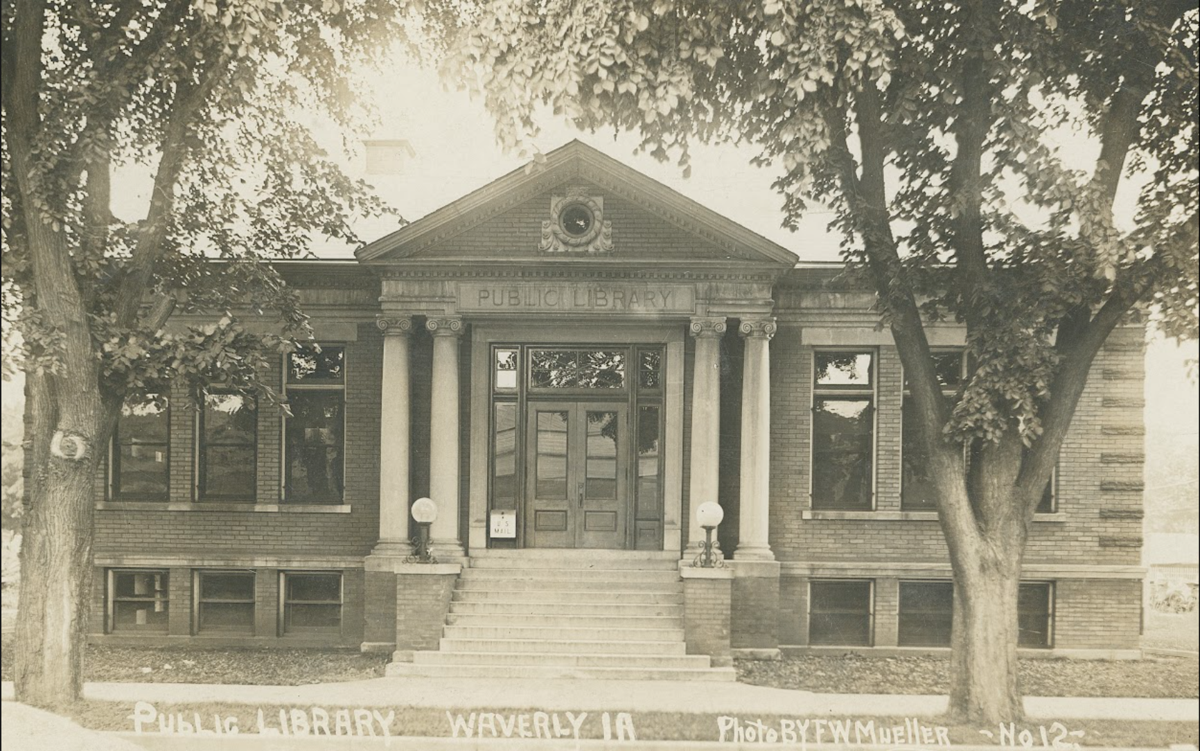 Undated, black and white exterior of Waverly Public Library. Photo taken by F.W. Mueller. Source: Waverly Public Library.